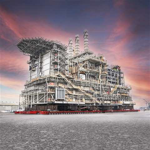 red Mammoet SPMT from TII Scheuerle under a 14,300 tonne oil platform topside